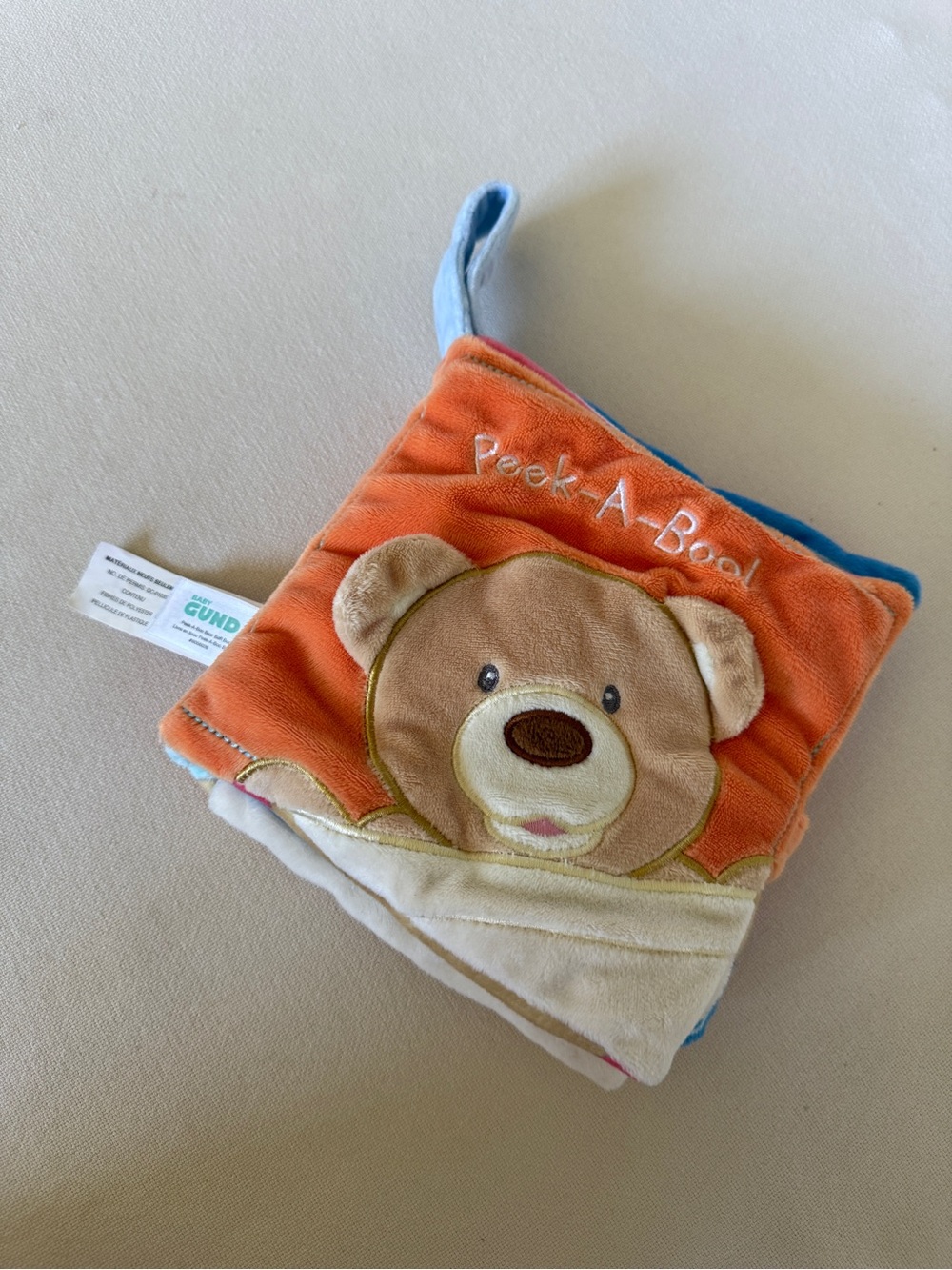 Gund Peek-A-Boo Bear Soft Fabric Book - Orange, Blue, Brown, Cream